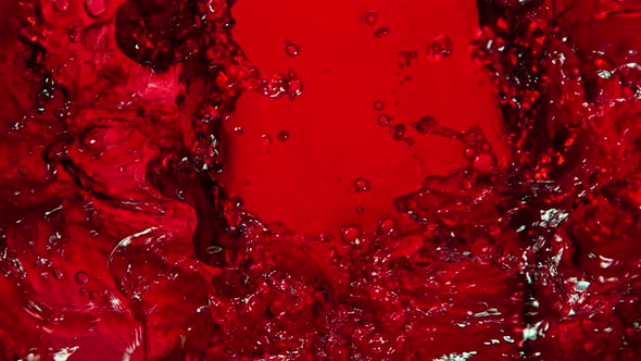 Super Slow Motion Shot of Rippling Fresh Red Wine Waves From Top Shot at 1000Fps. alt