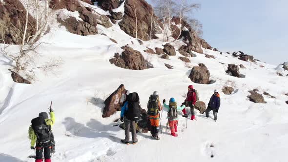 A Group of Tourists Stopped at the Stone and Discusses alt