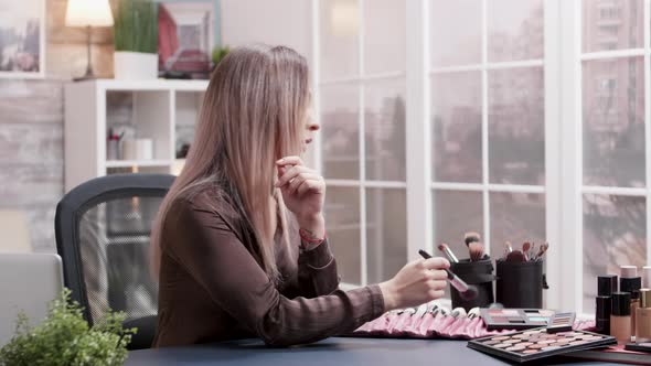 Beauty Blogger Making an Online Tutorial About Make Up alt