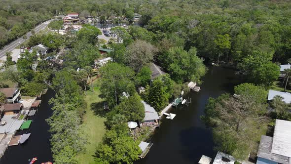 rising aerial twisting its way to Roger's Park on a weekend in Weeki Wachee, Florida.  A family-frie alt