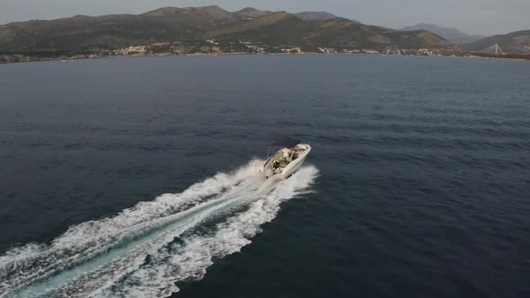 A speedboat speeds across the Adriatic sea near Dubrovnik, Croatia - Aerial alt