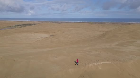 Walking on sand dunes by the sea in New Zealand