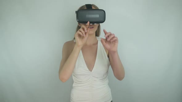 Young Girl Uses Virtual Reality Helmet Applications