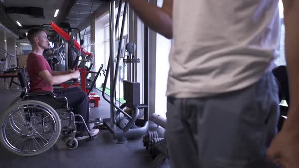 Man in a Wheelchair Working Out at the Gym