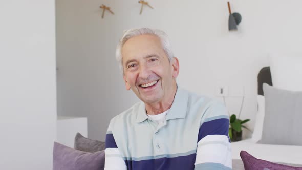 Animation of happy caucasian senior man looking at camera alt