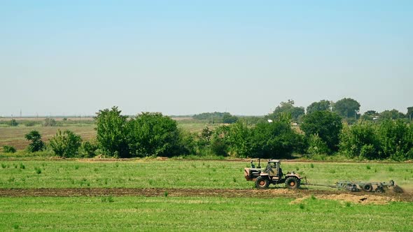 Tractor Preparing Land For Sowing