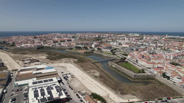 Peniche city suburb and sea in background, Portugal. Aerial forward