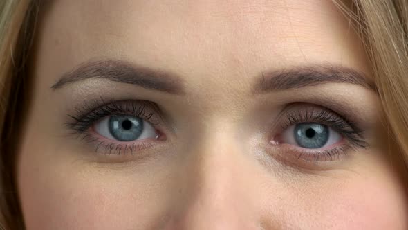 Beautiful Blue Eyes of Young Woman Close Up, Stock Footage | VideoHive