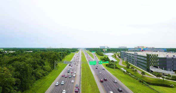 Daytime Traffic On The Highway In Orlando, Florida With Two Cars Stopped On The Breakdown Lane. aeri alt