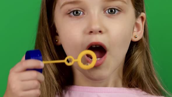 Baby Lets the Soap Bubbles. Green Screen. Close Up alt