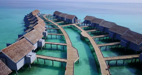 Beautiful overhead copy space shot of a white sand paradise beach and blue water background in hi re alt