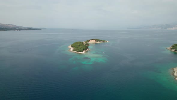 Aerial View of Tropical Beach in Ksamil Islands with Turquoise Water Albania alt