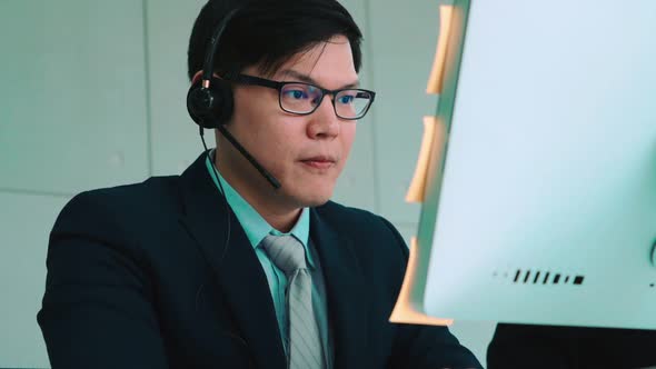 Business People Wearing Headset Working in Office alt
