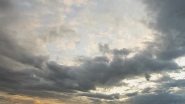 Time Lapse Footage of Fast Moving Evening Clouds on Yellow Sky at Sunset alt
