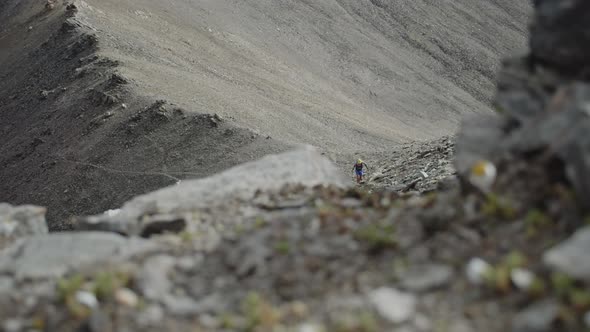 Man Climbing on a Rocky Pass in a Big Mountains Epic Adventure