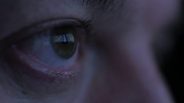 Middle Aged Man's Eyes While Surfing Internet at Night
