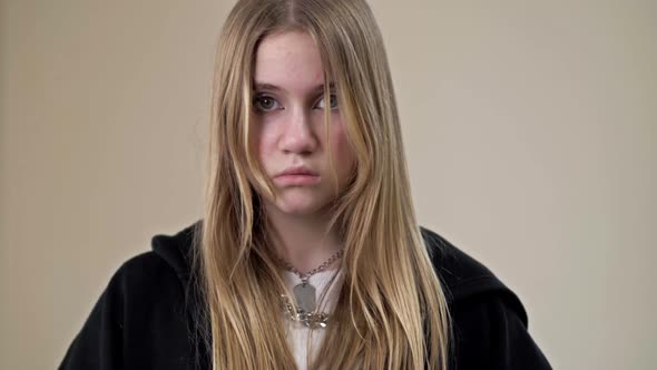 Portrait of a Frustrated Teenage Girl Showing Her Palms with the Inscription HELP ME alt
