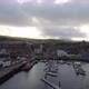 Panning over the harbor towards downtown Campbeltown on a cloudy day