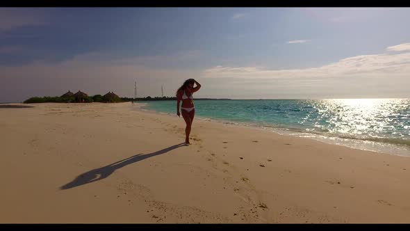 Woman suntans on luxury sea view beach trip by blue ocean with white sandy background of the Maldive alt