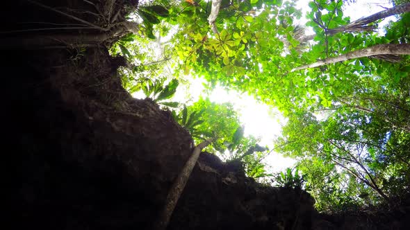 Grande Cenote in Mexico Time Lapse From Inside Sun Rays and Clouds