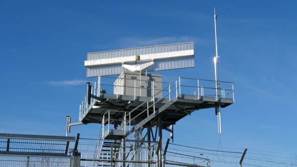 Airport surveillance radar controlling air traffic, static close up alt