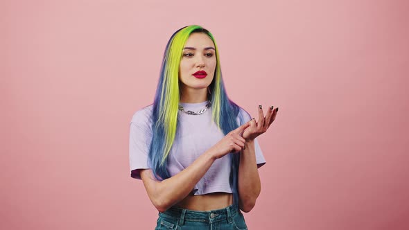 Young Pretty Pensive Woman with Colorful Hair Planning Event Counting Guests or Dotolist on Fingers alt