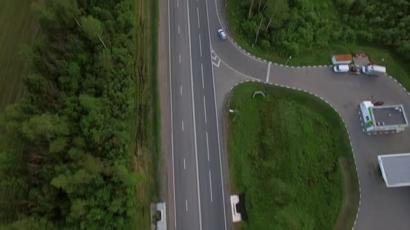 Aerial Shot of Transport Traffic on Countryside Road alt