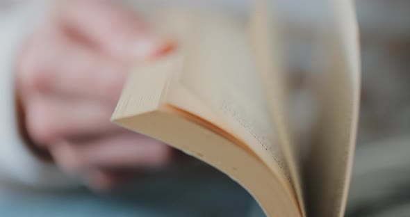 Female Hands Closeup Quickly Flip Through All the Pages of the Book alt