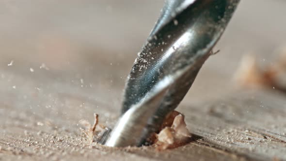 Super Slow Motion Detail Shot of Drilling Wood at 1000 Fps alt