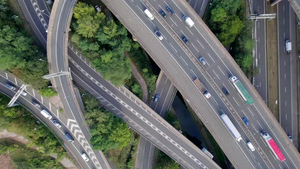Vehicles Driving on a Spaghetti Interchange Bird's Eye Aerial View alt