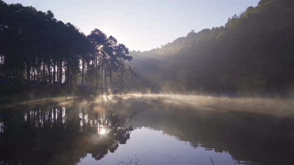 Fog or mist on river lake with forest trees in Pang Ung reservoir, Mae Hong Son, Thailand alt