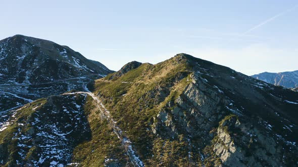 Aerial, Alps Mountains Partially Covered With Snow In Italy