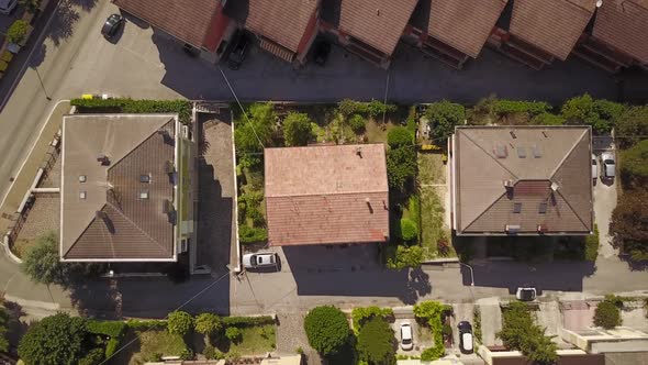 Top shot with a drone of some houses in the small city of Fabriano, in Italy during summer alt