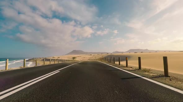 Travel and drive concept - long way off road viewed from car nose ground level alt