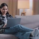Smiling Asian Woman Using Laptop Casual Browsing Searching Online Play Computer Game - VideoHive Item for Sale