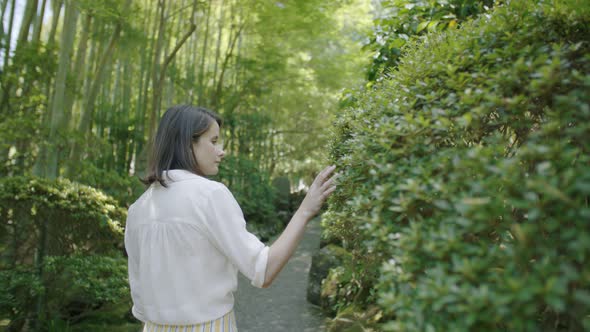 Young girl walking in a Japanese garden 