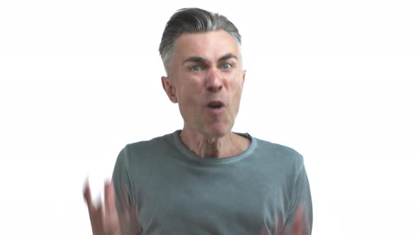 Middleaged Man with Grey Hair and Bristle Wearing Casual Clothes Losing Temper and Shouting alt