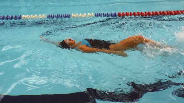 Training Of Young Female Amateur Swimmer In Swimming Pool