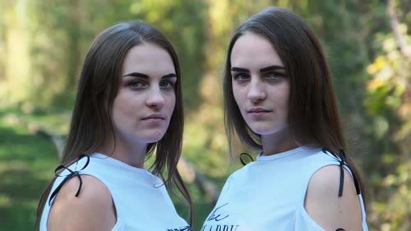 Twins Girls Railroad Look Camera Green Nature Background alt