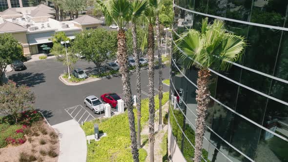 Car Charging on Background of Modern Business Park in the City Center Aerial alt