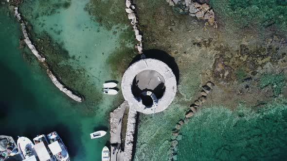 Venetian castle in Naoussa on Paros island in the Cyclades in Greece aerial view alt