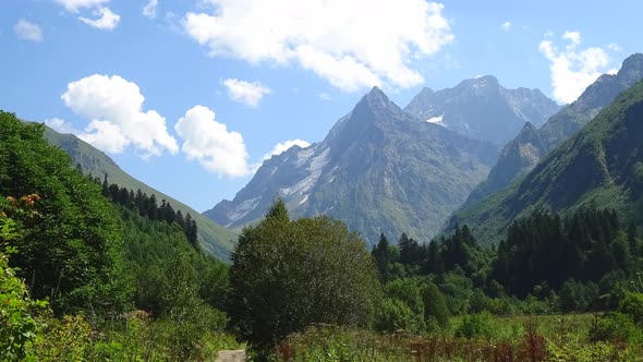 Timelapse scene in mountains of national park of Dombay, Caucasus, Russia