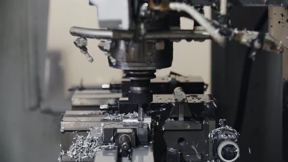 Automated Cnc Turning Lathe Machine Cutting Metal Part at Factory alt