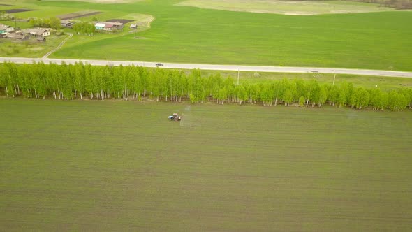 Tractor On the Farm Field alt