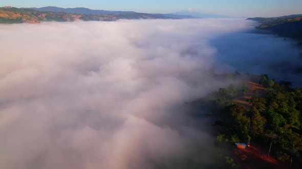 4K Drone Flying in the clouds. Flying through the clouds during sunrise alt