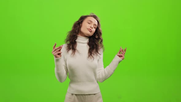 The Woman is Standing and Looking at the Camera alt