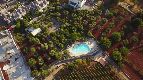 Top view of a pool in the italian countryside, mavic drone aerial shot alt