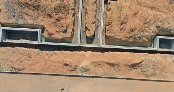 Building territory preparations construction of foundation for future apartment complex alt