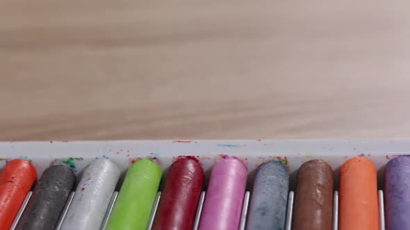 Colored Pastels For Drawing.  In Open Packaging. Slider Camera. Close Up.