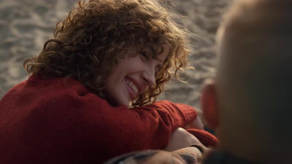 Smiling Woman and Man Dating on Beach alt